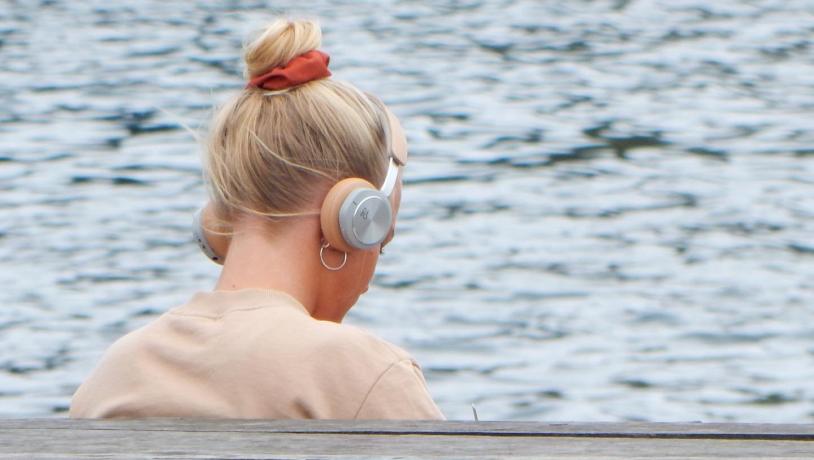 Young woman with headphones on in Copenhagen