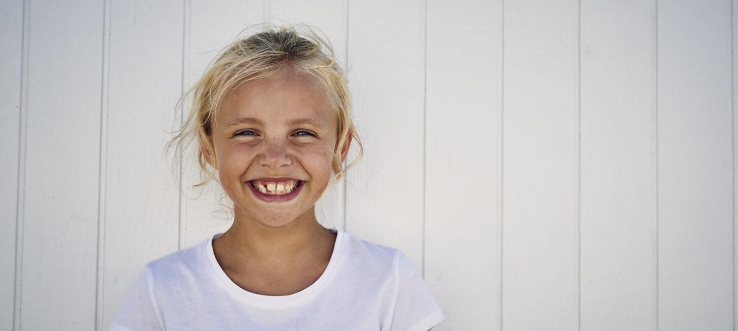 Girl smiling at beach in North Jutland, Denmark