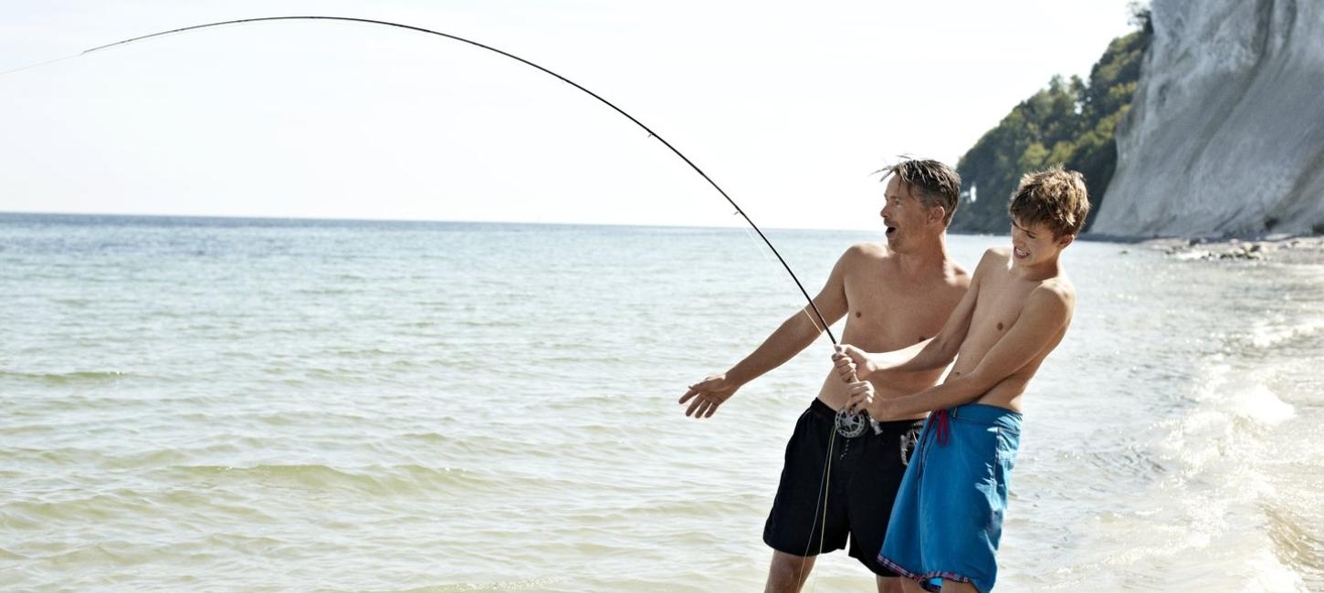 Father and son fishing at Møns Klint