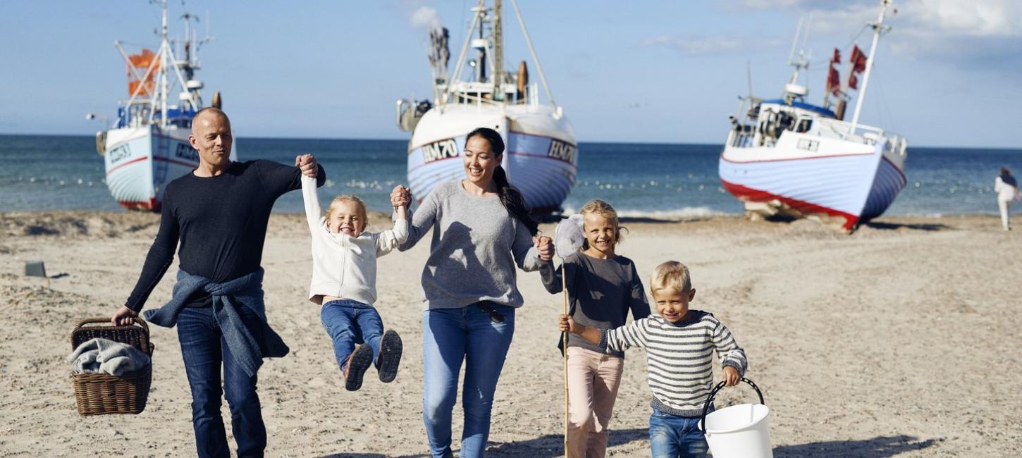 Family playing at Thorup Beach