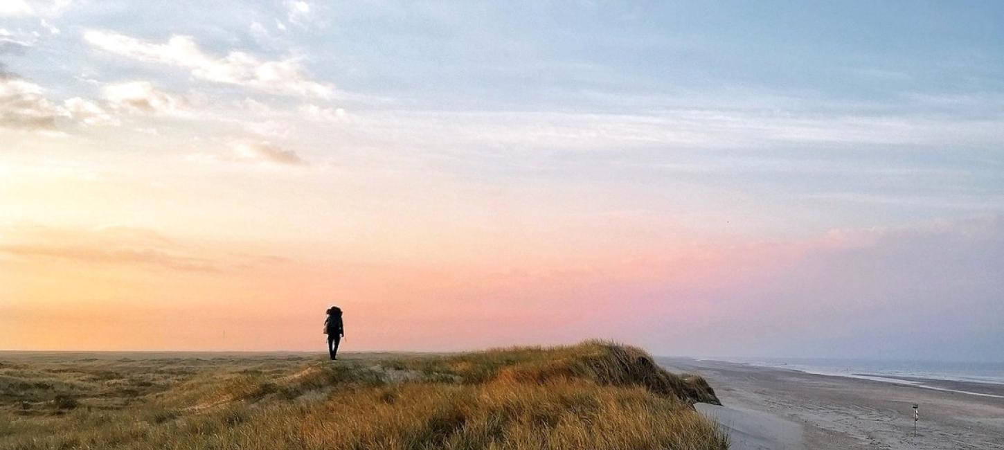 A person hiking along Skallingen on the West coast.