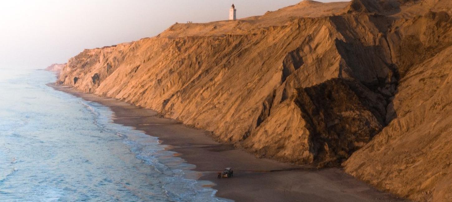 Rubjerg Knude Lighthouse view with cliffs and sea, North Jutland