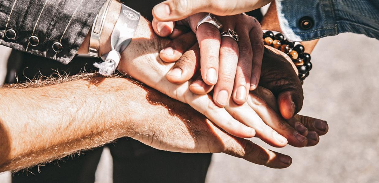 Paul Cauthen Bands hands together