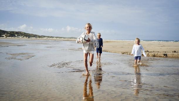 Kids running on Saltum Beach in North Jutland