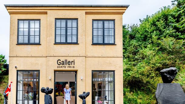 Woman going into a Gallery in Lønstrup , Northjutland