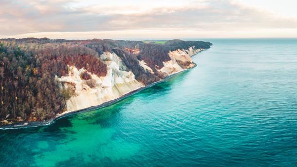 Møns Klint, a cliff in Southern Denmark, seen from above, with turquoise waters