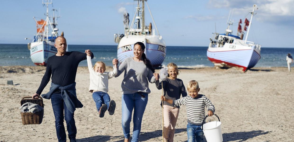 Family playing at Thorup Beach