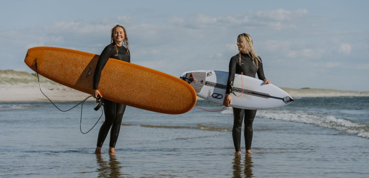 Two female surfers in Hvide Sande on the Danish West coast.