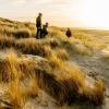 Family in dunes at Blåvand beach, West Jutland