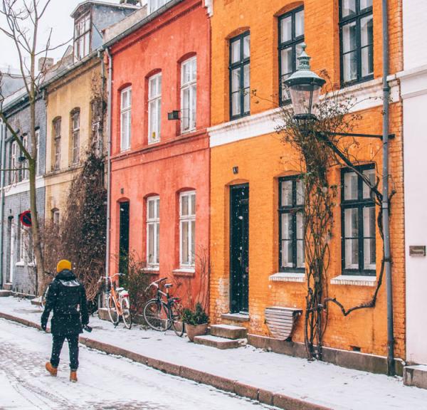 Colourful terraced houses in Copenhagen in winter, snow on the ground
