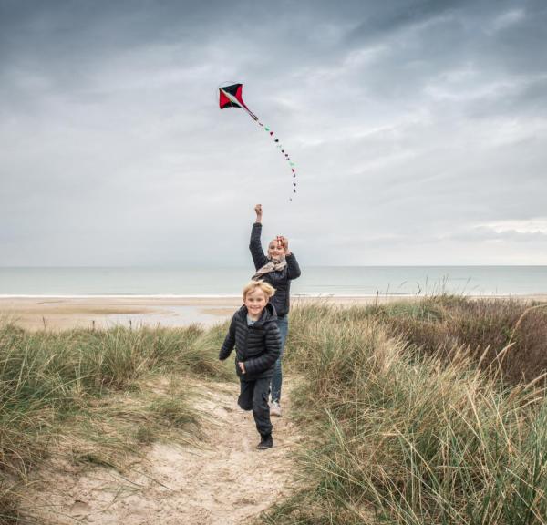 Mother and son at the beach with a kite, Northjutland