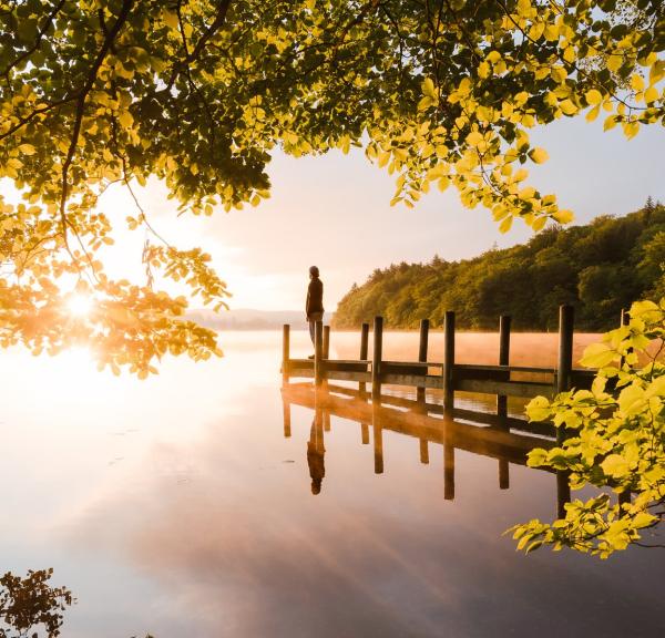 Man standing at the  Borre Sø in the sunset, Silkeborg, Denmark