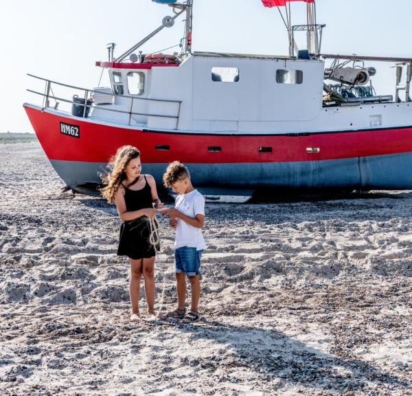 Children playing at Thorup Strand in North Jutland, Denmark