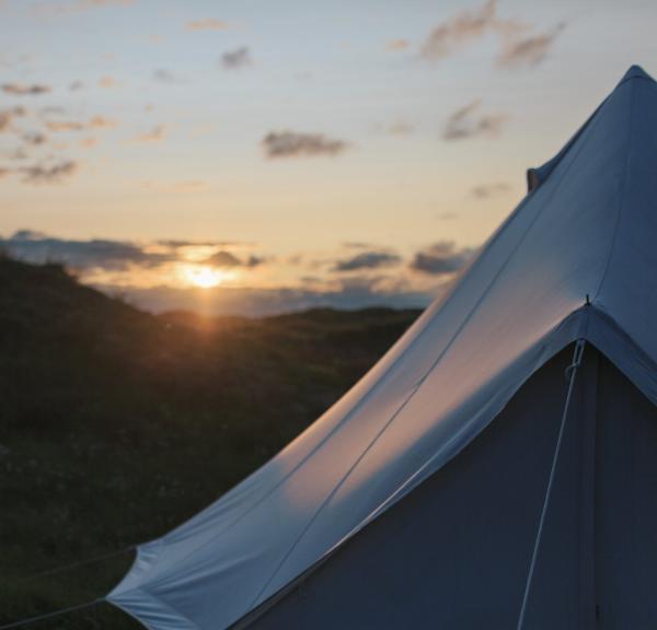 Glampingtent in the dunes at sunset on the Danish westcoast