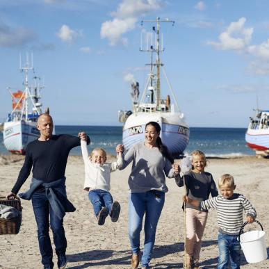 Family playing at Thorup Beach