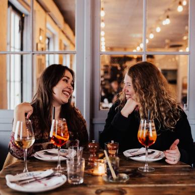 Two women eating dinner at Undici, a restaurant in the neighbourhood Christianshavn in Copenhagen, Denmark