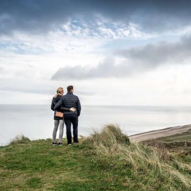 Couple standing at Bulbjerg, Northjutland