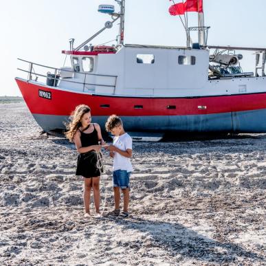 Children playing at Thorup Strand in North Jutland, Denmark