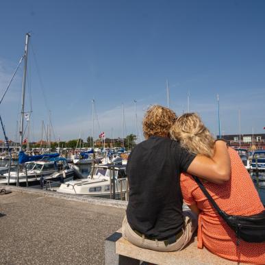 Couple looking at the harbour in Juelsminde