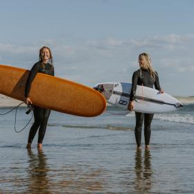 Two female surfers in Hvide Sande on the Danish West coast.
