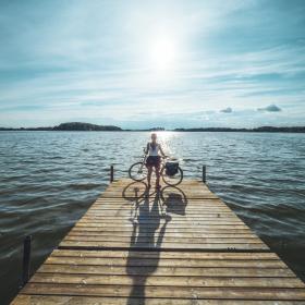 Woman and bike at Maribo Lakes