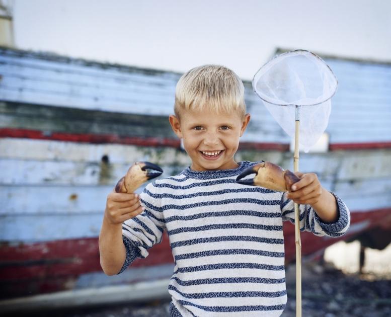 Boy fishing at Thorup Strand