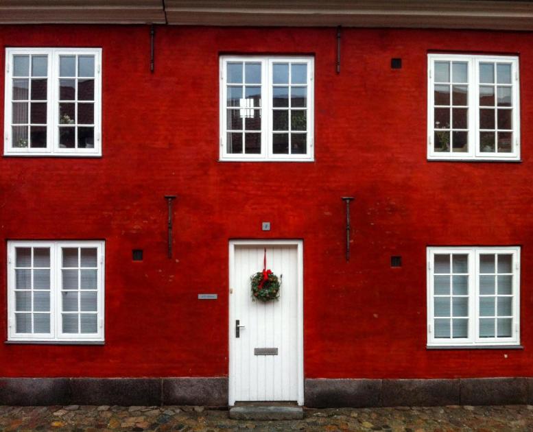 Red building with Christmas wreath in Copenhagen