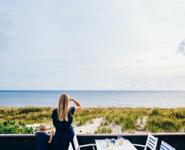 Mother and son on a terrace at Grenå beach, Denmark