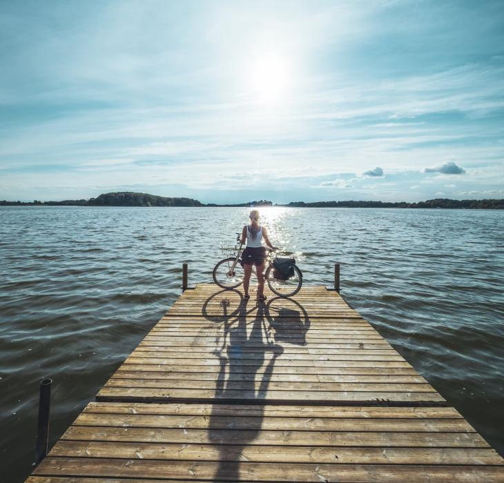 Woman and bike at Maribo Lakes